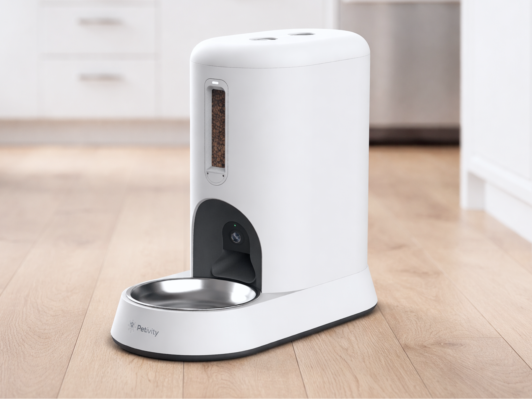 Petivity Smart Feeder for Cats on kitchen floor, white design with stainless steel bowl