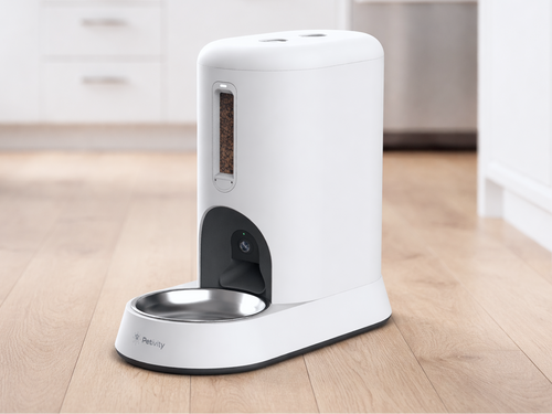 Petivity Smart Feeder for Cats on kitchen floor, white design with stainless steel bowl