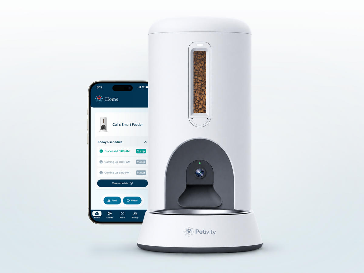The Petivity Smart Feeder for Cats is a sleek, white auto feeder. The Smart Feeder is controlled by the Petivity app. 