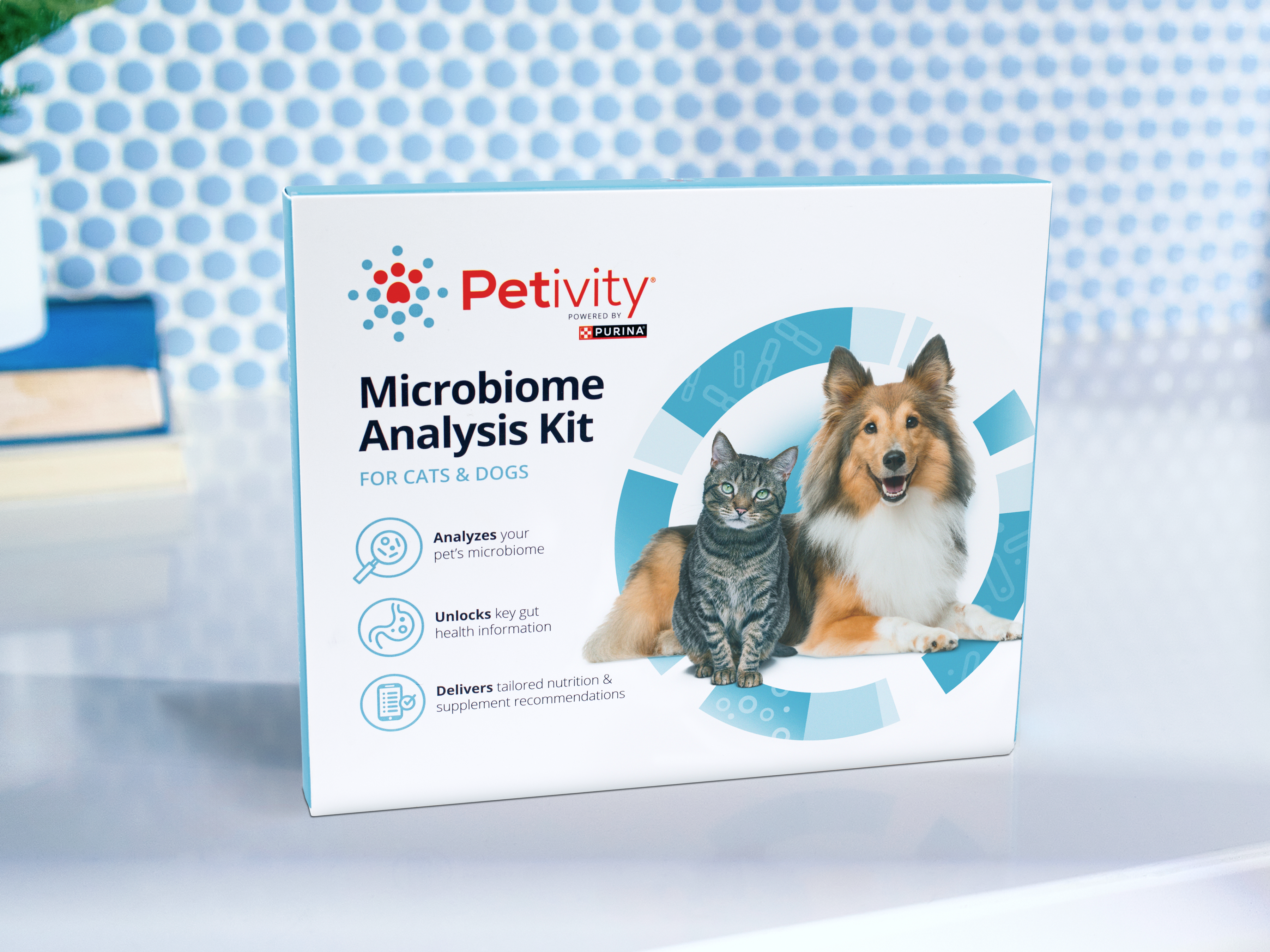 Petivity Microbiome Analysis Kit for Dogs & Cats – Product box featuring a cat and a dog on the front, with icons indicating analysis of the pet’s microbiome, unlocking gut health information, and delivering tailored nutrition recommendations.