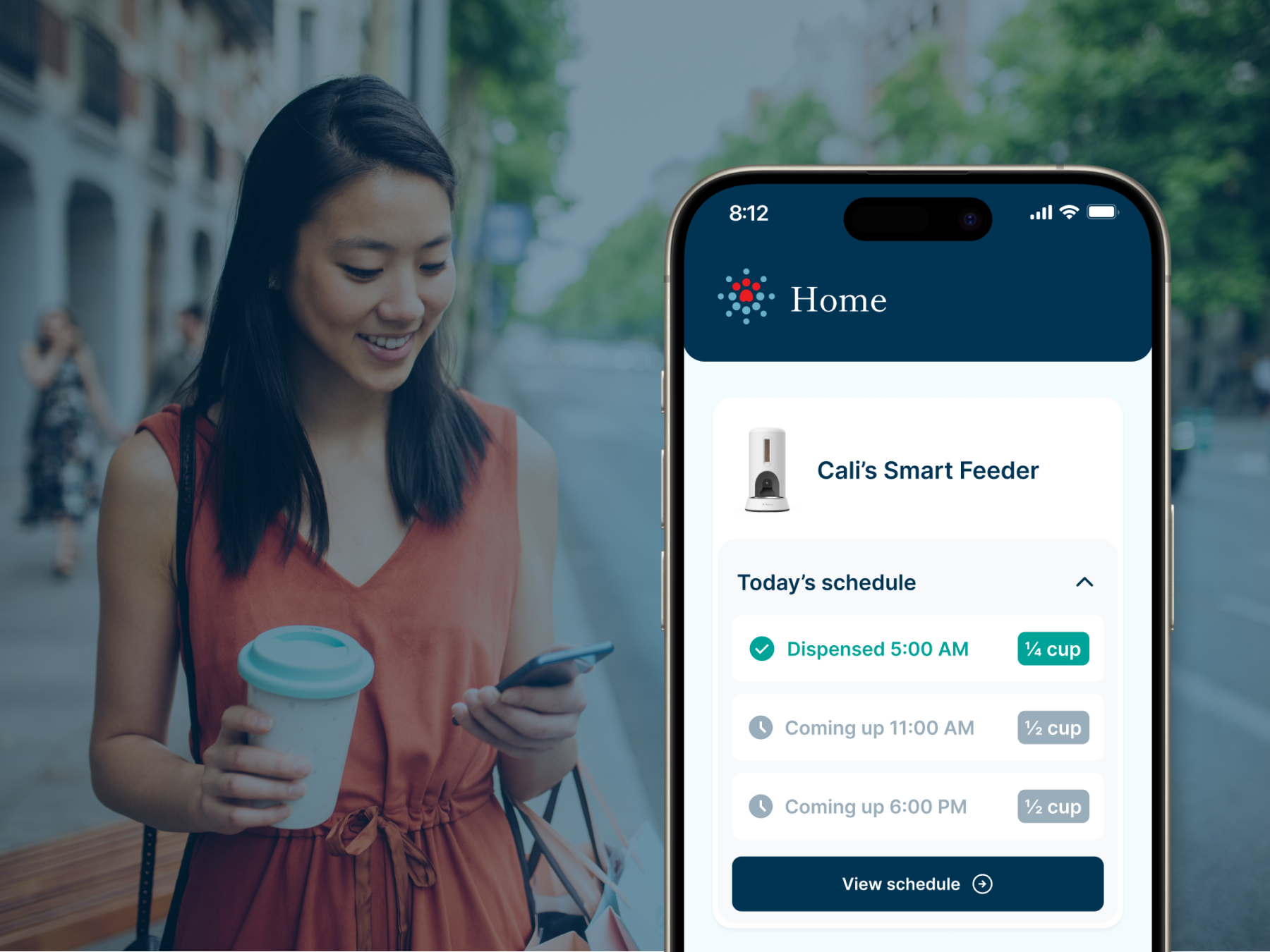 Pet owner checking Petivity app feeding schedule on smartphone while away from hone