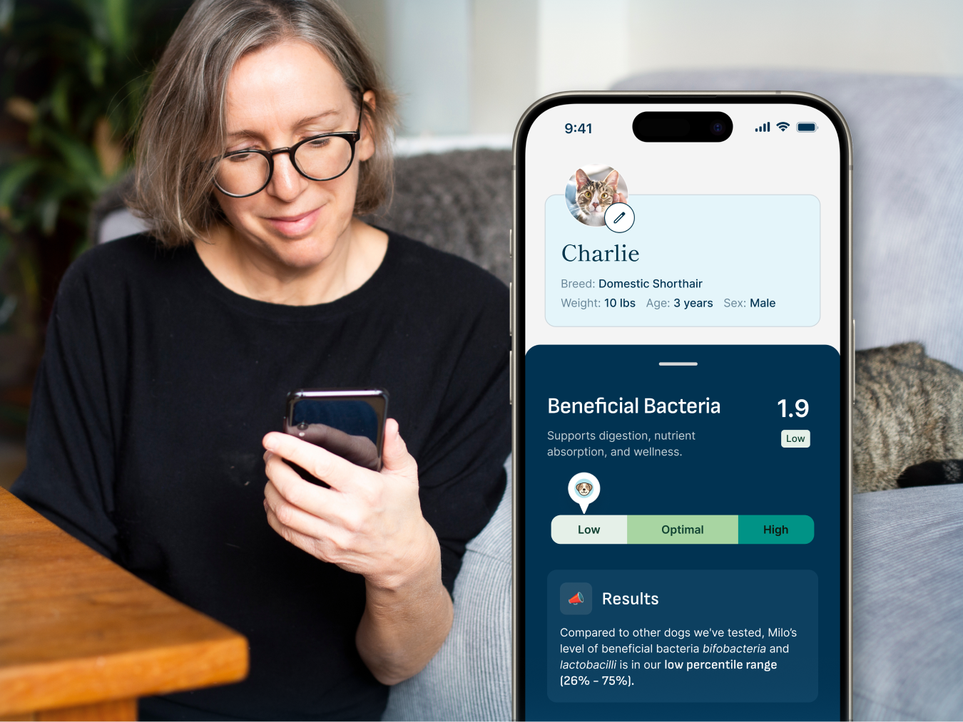 A woman watching the petivity app displaying her pet's bacteria health information.