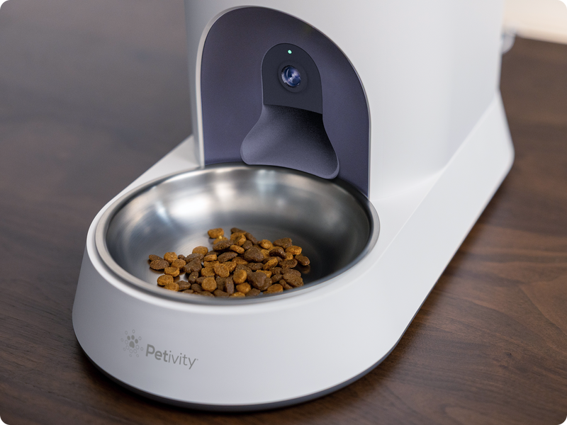 Cat kibble in a stainless steel bowl that's part of the Smart Feeder for Cats.