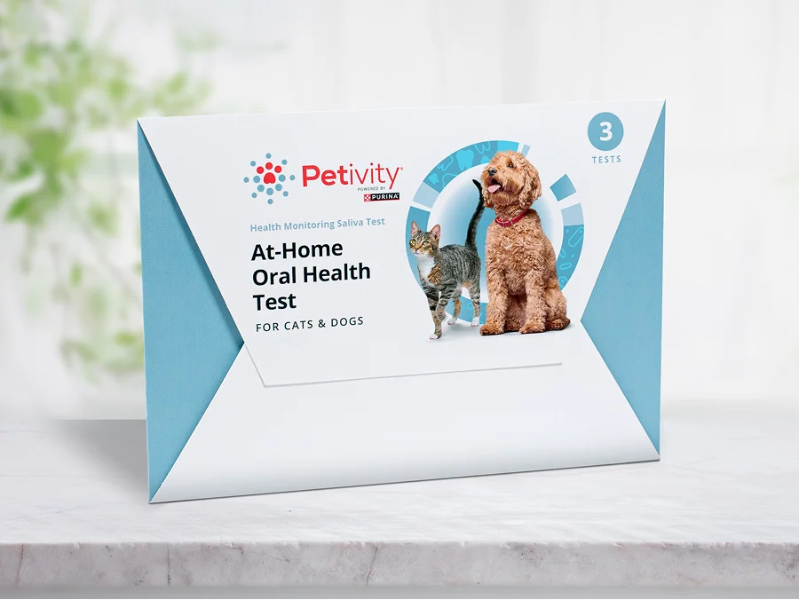 Petivity At-Home Oral Health Test kit for cats and dogs with packaging showing a cat and a dog on a white surface.